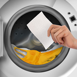 add a laundry sheet into the machine drum